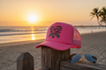Summer Nights Trucker Hat in sunset setting